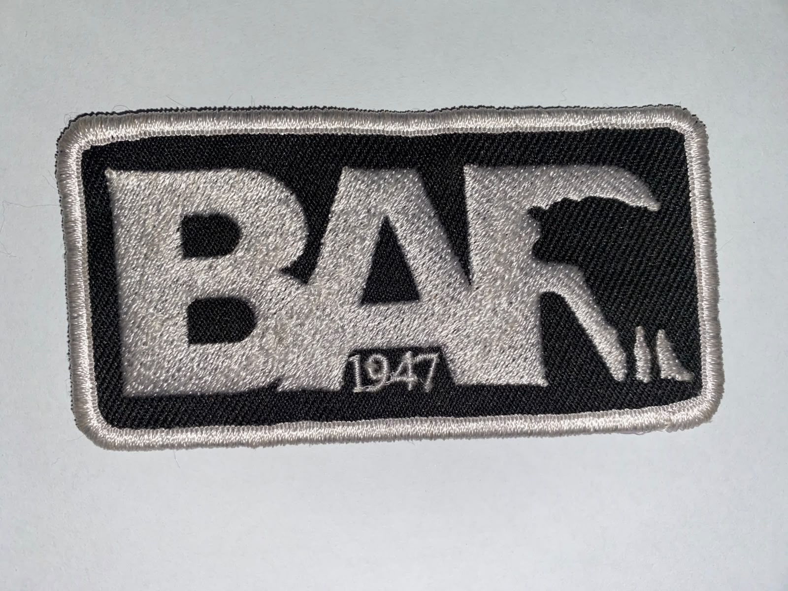 Black and white rectangular brand badge embroidery patch reading BAR 1947